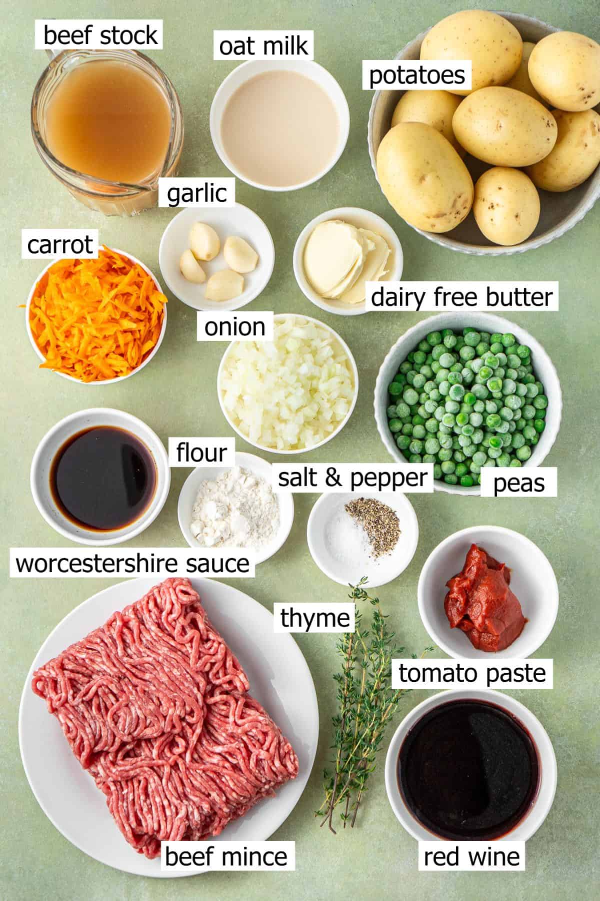 All ingredients needed to make cottage pie laid out in bowls.