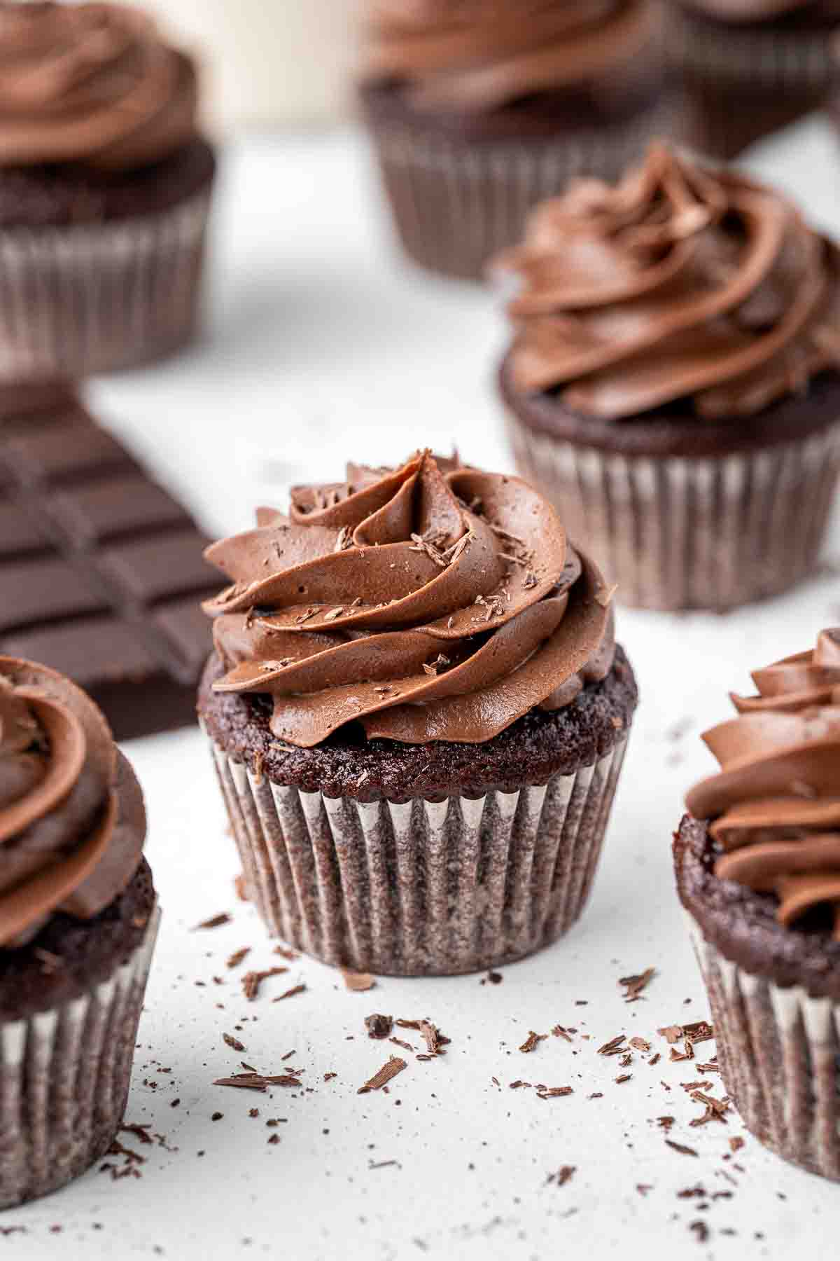 Vegan chocolate cupcake with a block of dark chocolate.