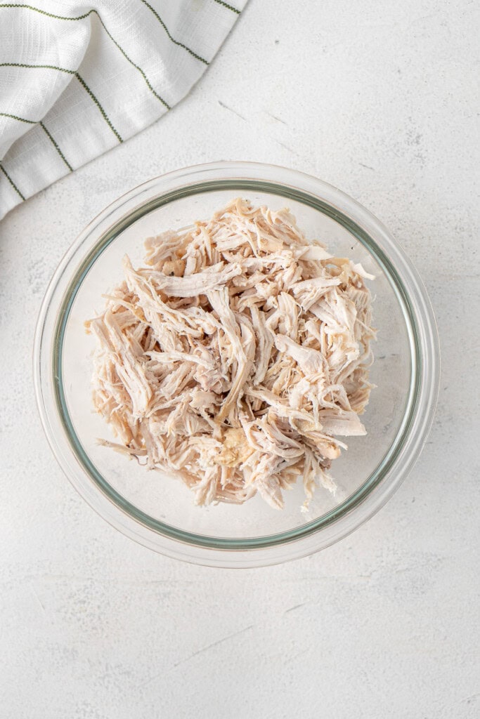 The shredded chicken in a bowl.