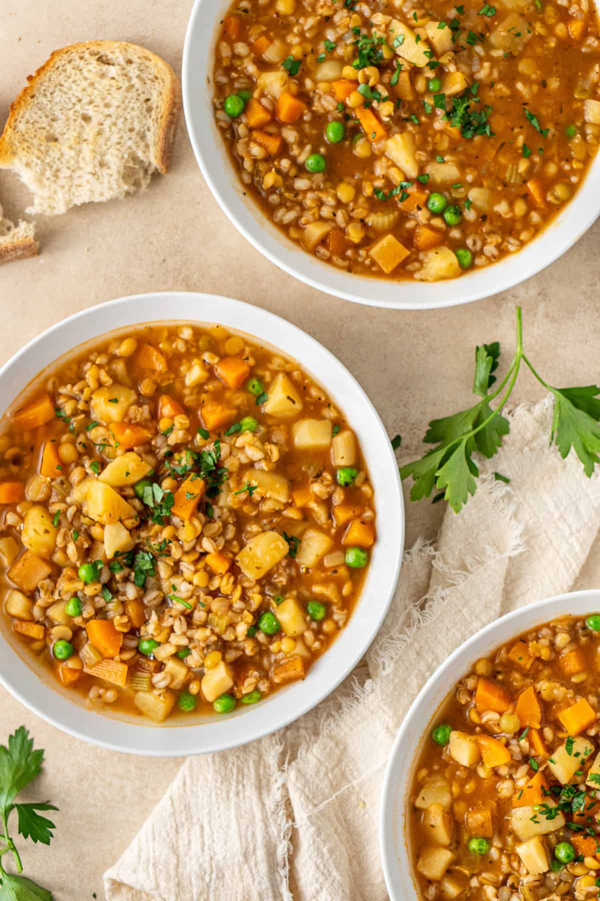 Bowls of healthy vegetable soup served up into bowls.