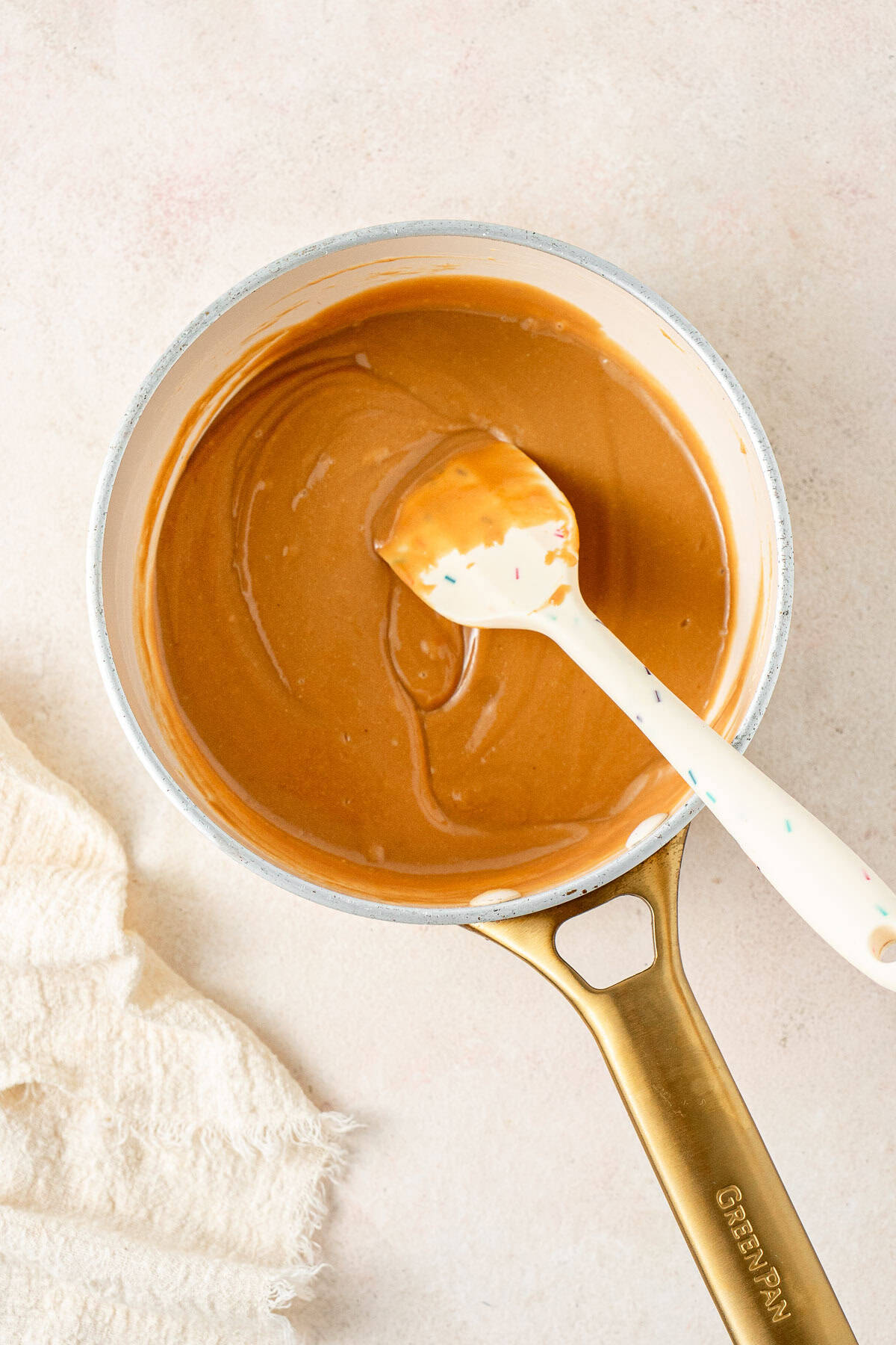 The peanut butter and honey mixture in a small saucepan.