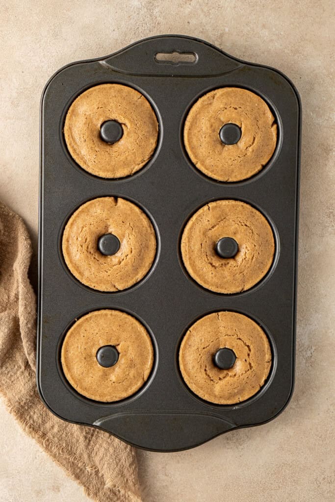 The baked doughnuts in a pan.
