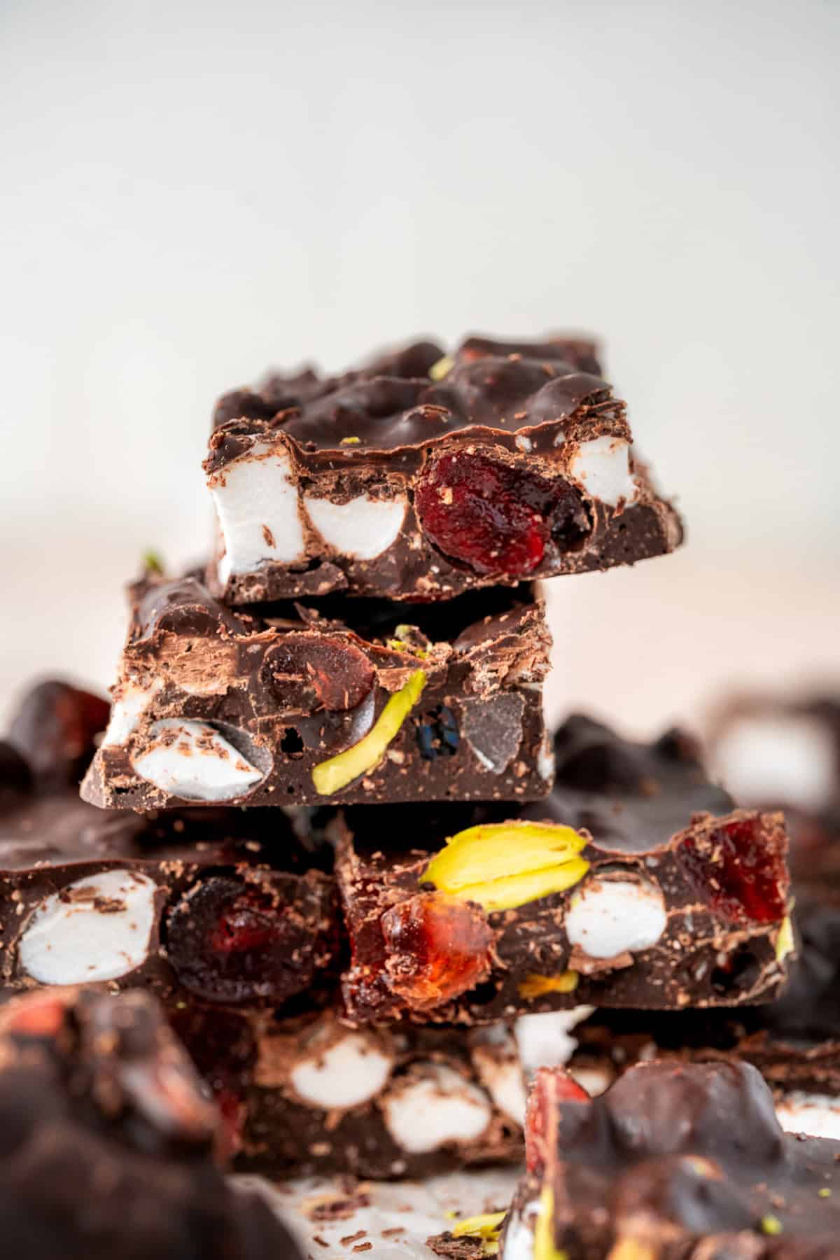 Pieces of dark chocolate stacked on top of each other. 