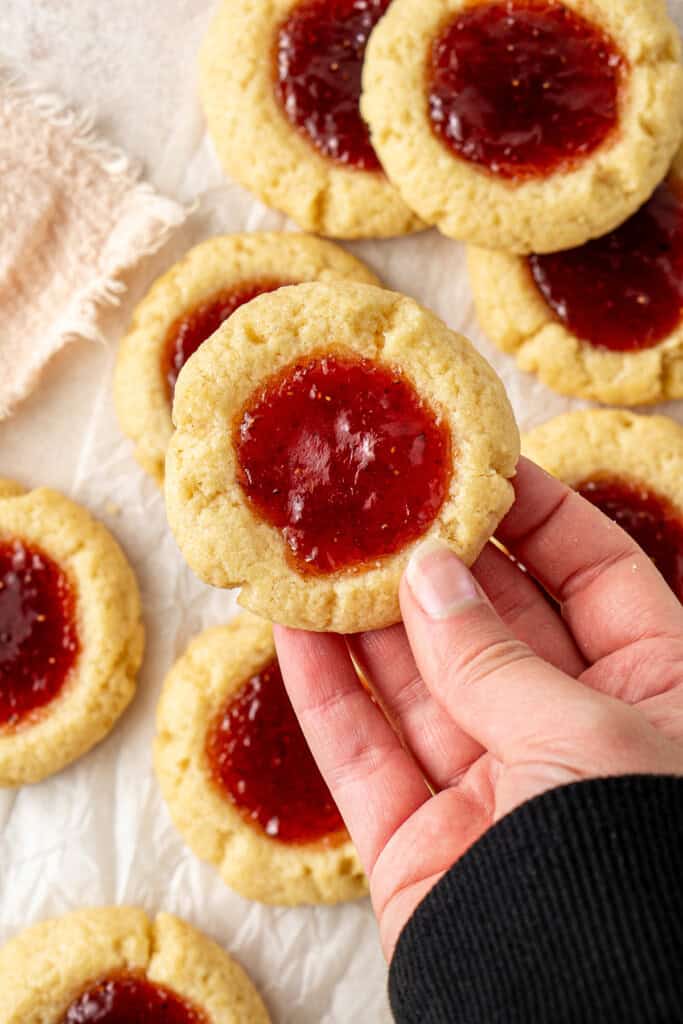 A hand holding a jam drop.