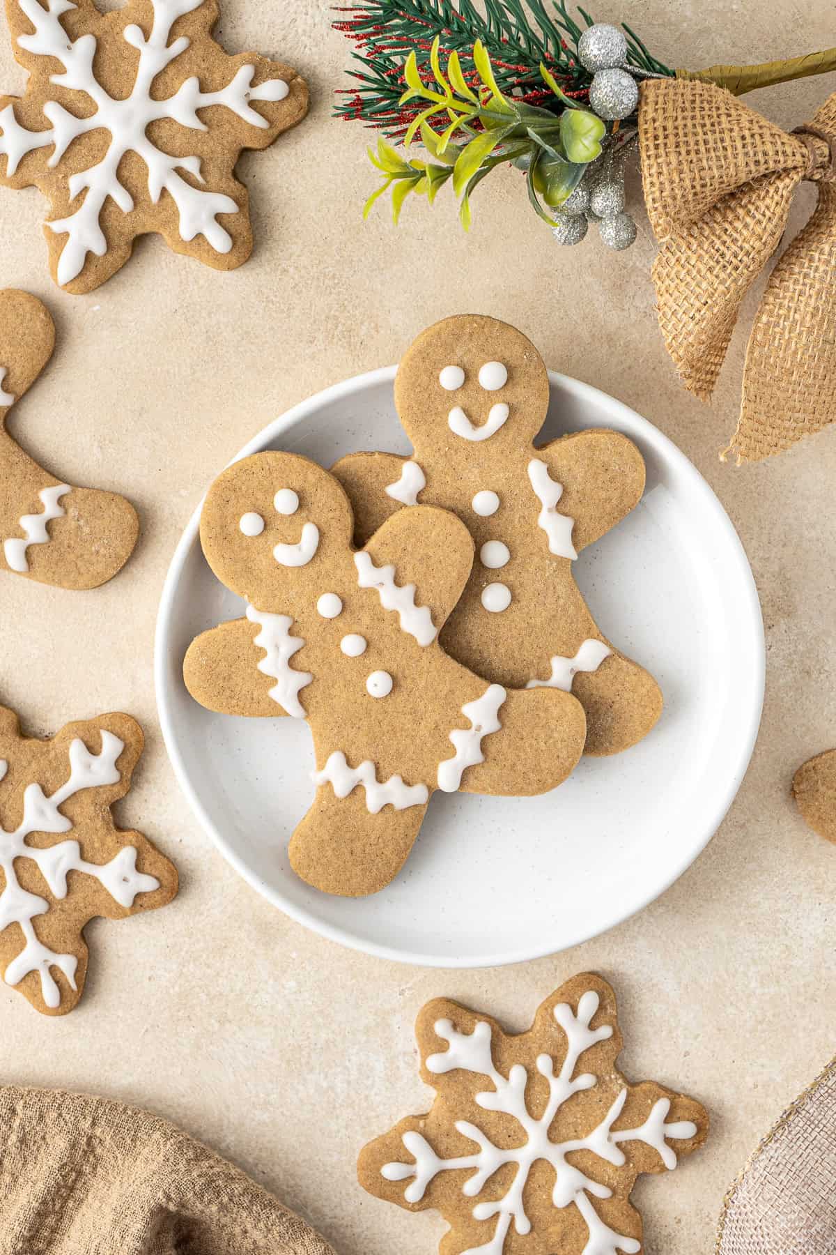 Two vegan gingerbread men sitting on a plate.