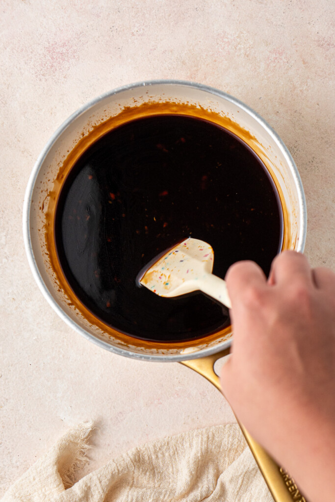 Making the teriyaki sauce in a small saucepan.