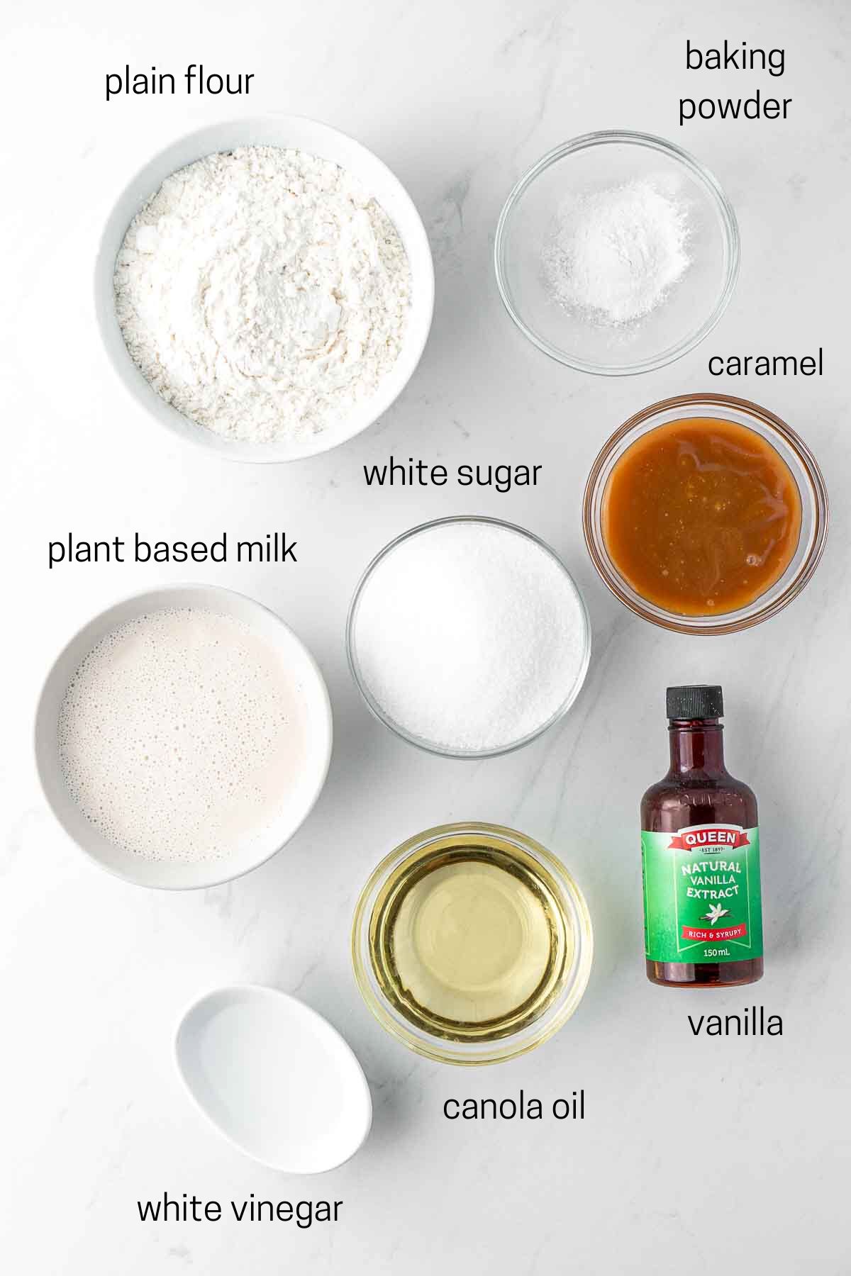All ingredients needed to make vegan caramel cake laid out in bowls.