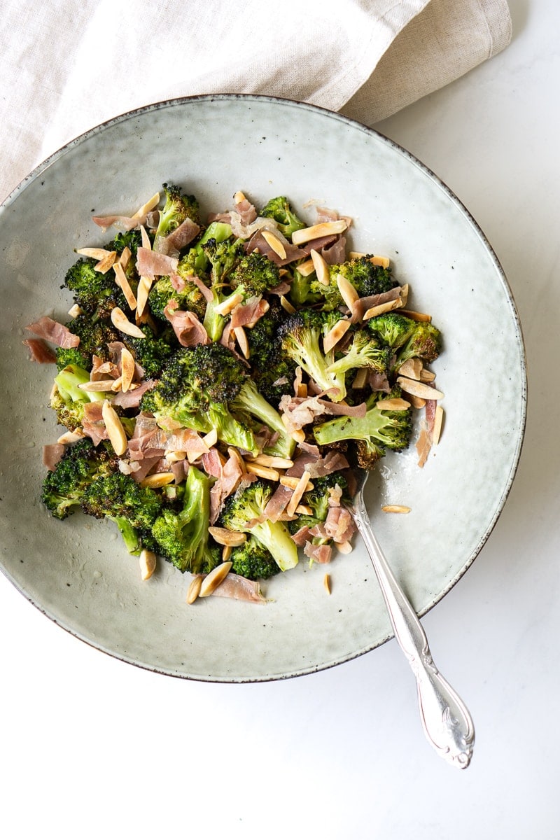 Roasted Broccoli Salad with Almonds and Prosciutto in a bowl.