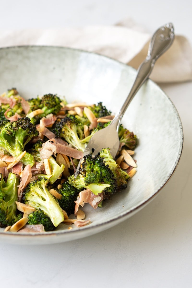 Bow of broccoli salad with a fork