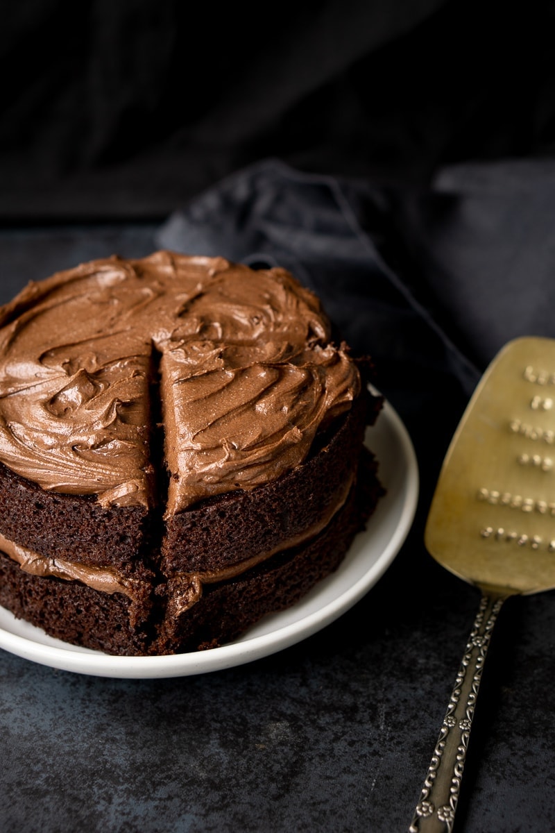 Chocolate cake with large slice cut