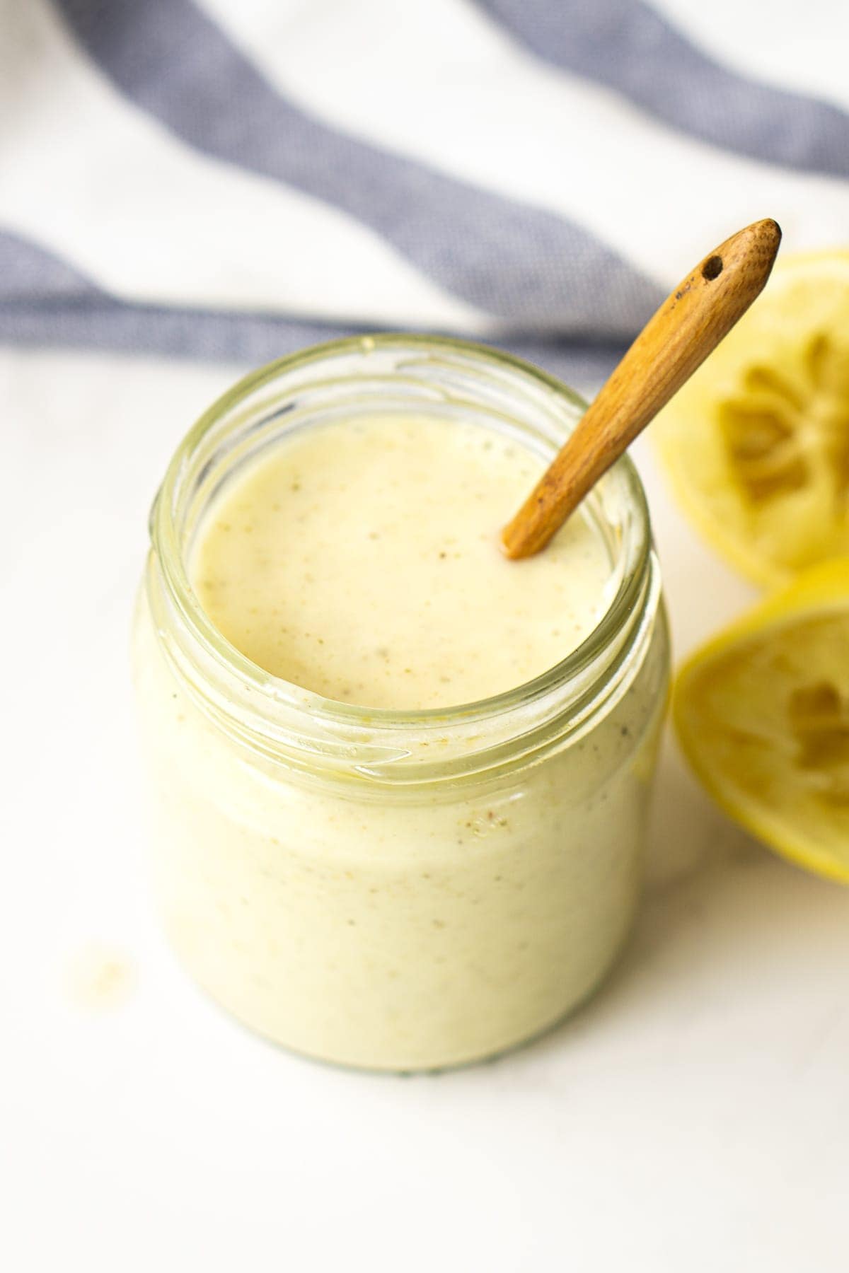 Lemon Garlic Sauce in a Jar with a Spoon