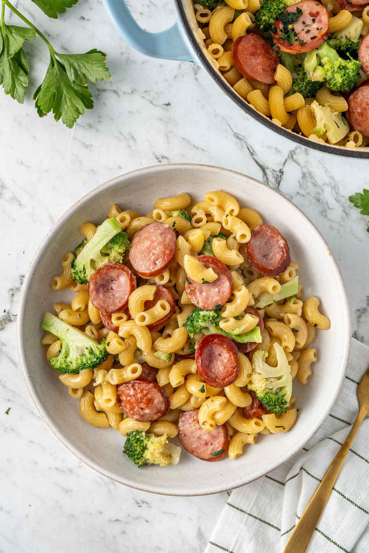 The one pot sausage and broccoli pasta served into a bowl.