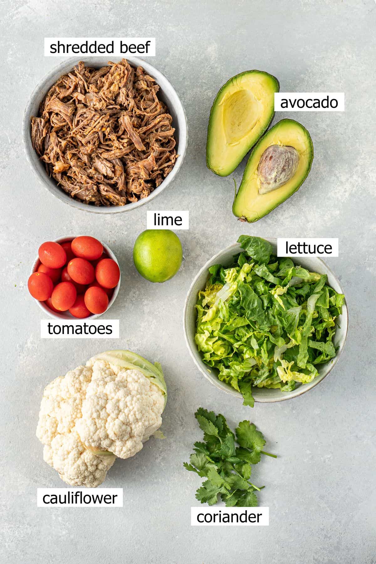 All ingredients needed to make beef burrito bowls with cauliflower rice. 