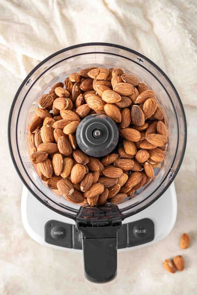 Roasted almonds in the food processor.