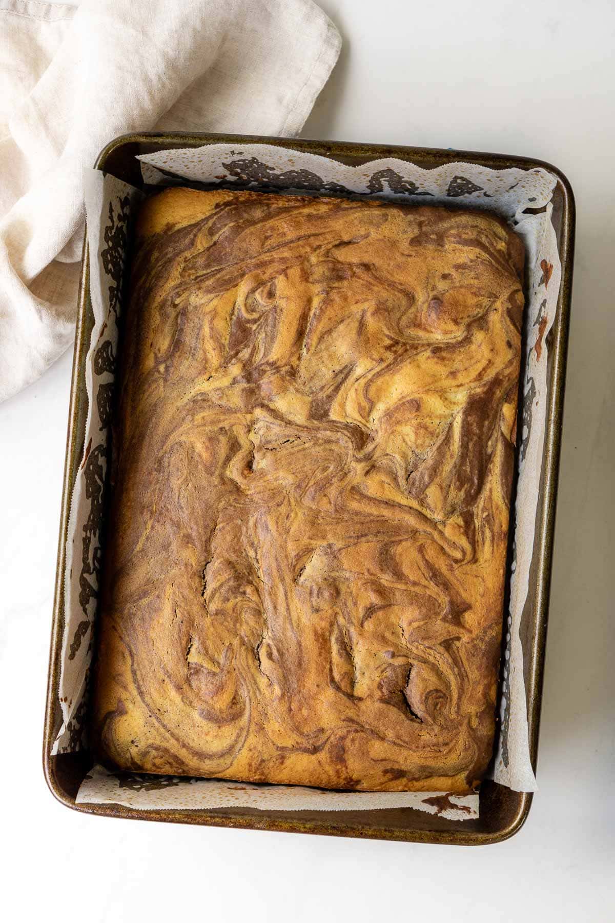 Just baked marble sheet cake still in the pan