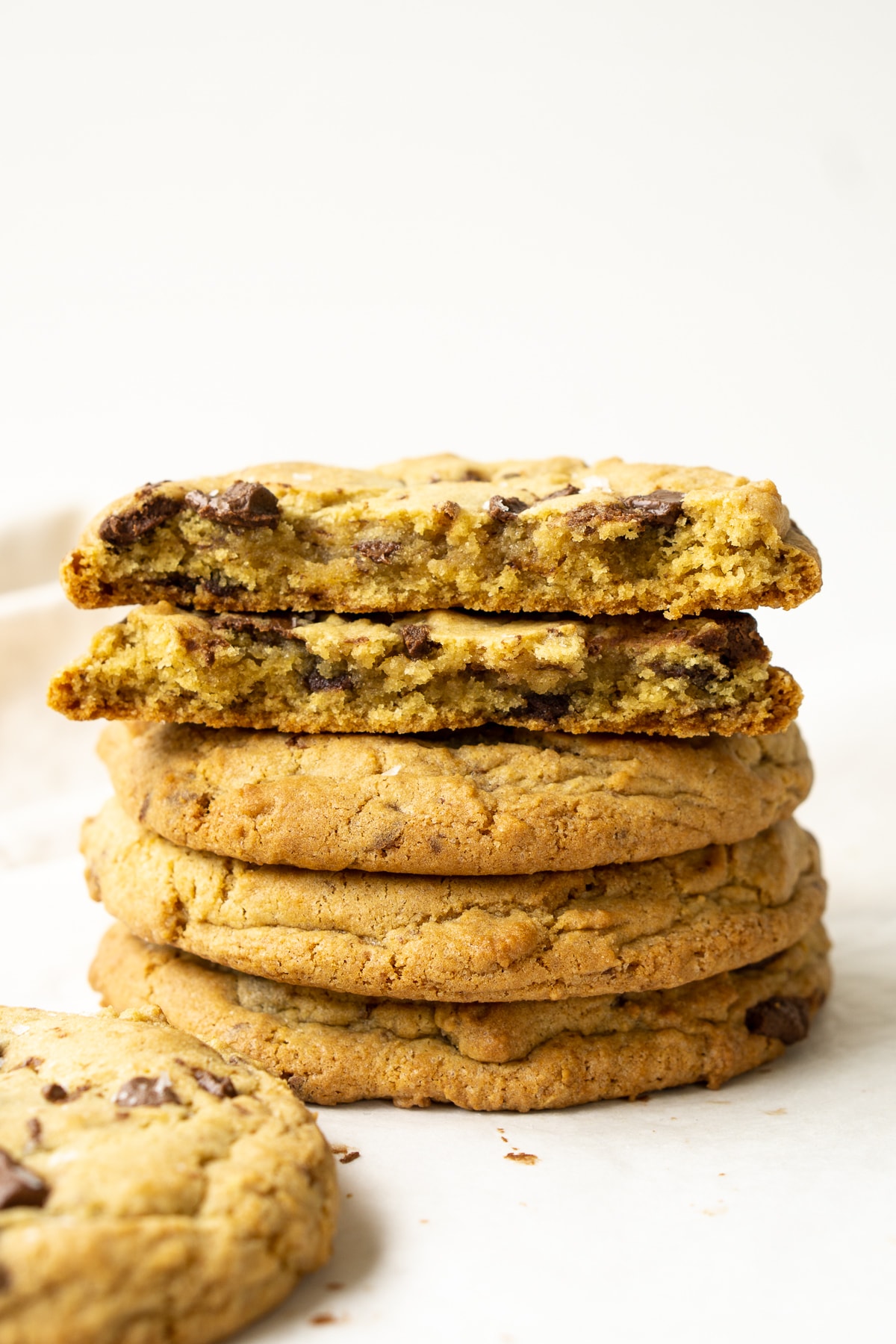 Stack of giant chocolate chip cookies.