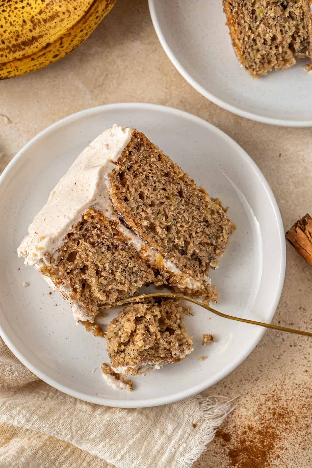 A slice of cake on a plate with a fork.