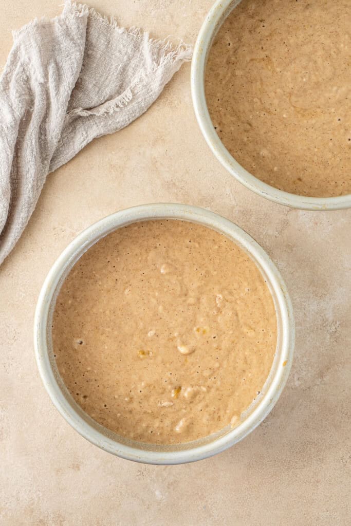 The cake batter in the cake pans.