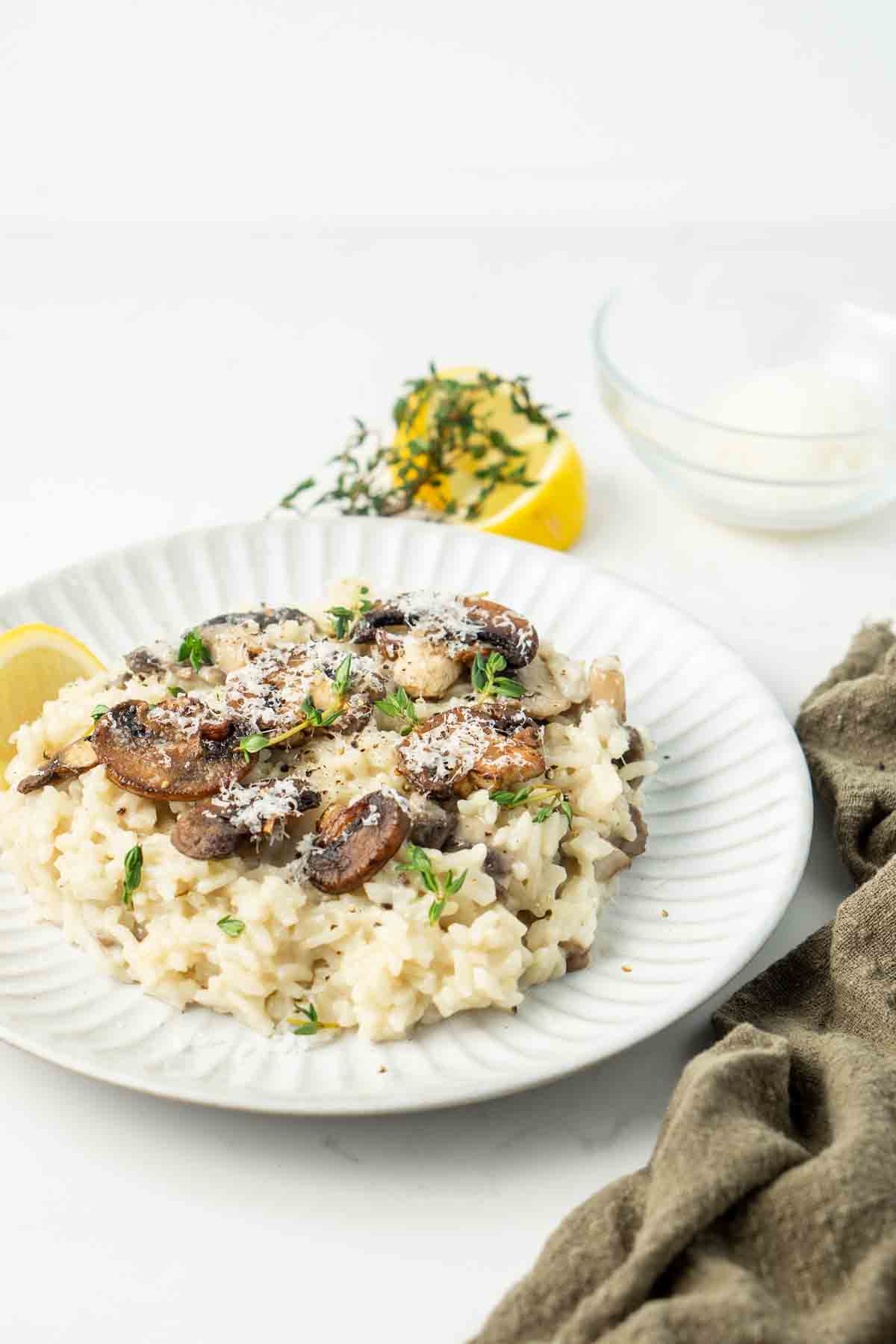Mushroom risotto served on a white plate.