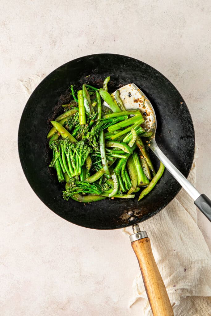 Stir frying the the vegetables.