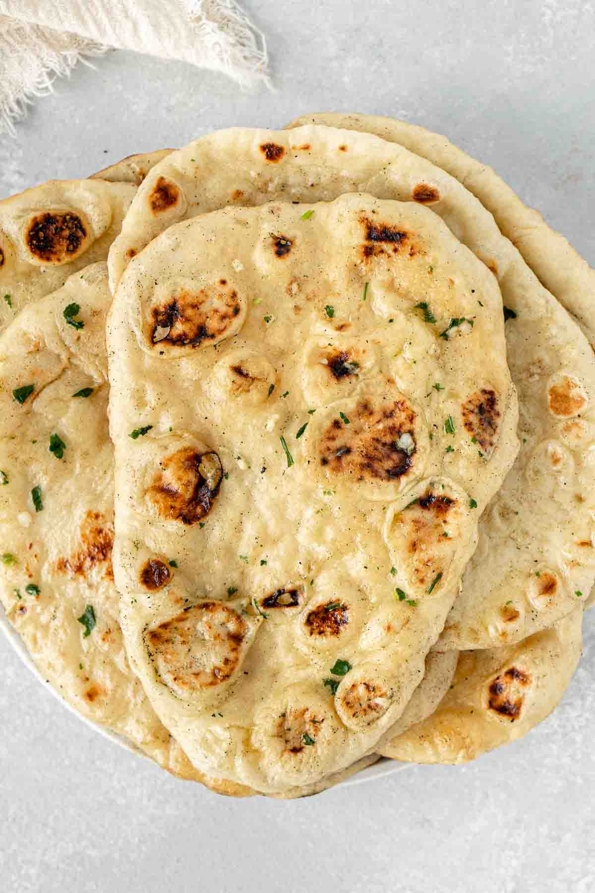 Vegan naan bread on a plate.