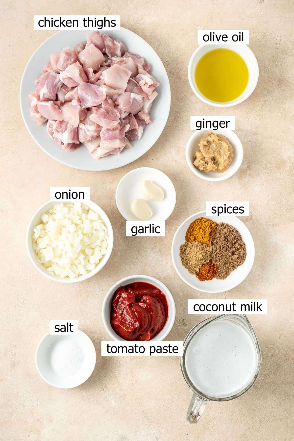 All ingredients needed to make dairy free butter chicken laid out in bowls.