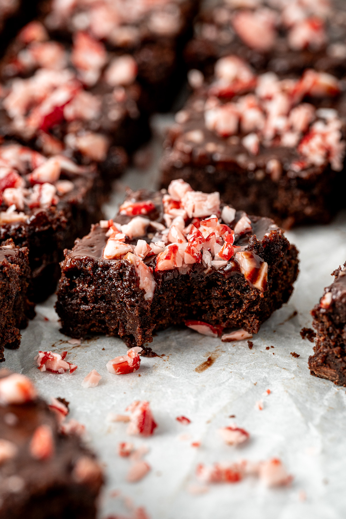 Close up of a chocolate peppermint brownie with a bite taken.