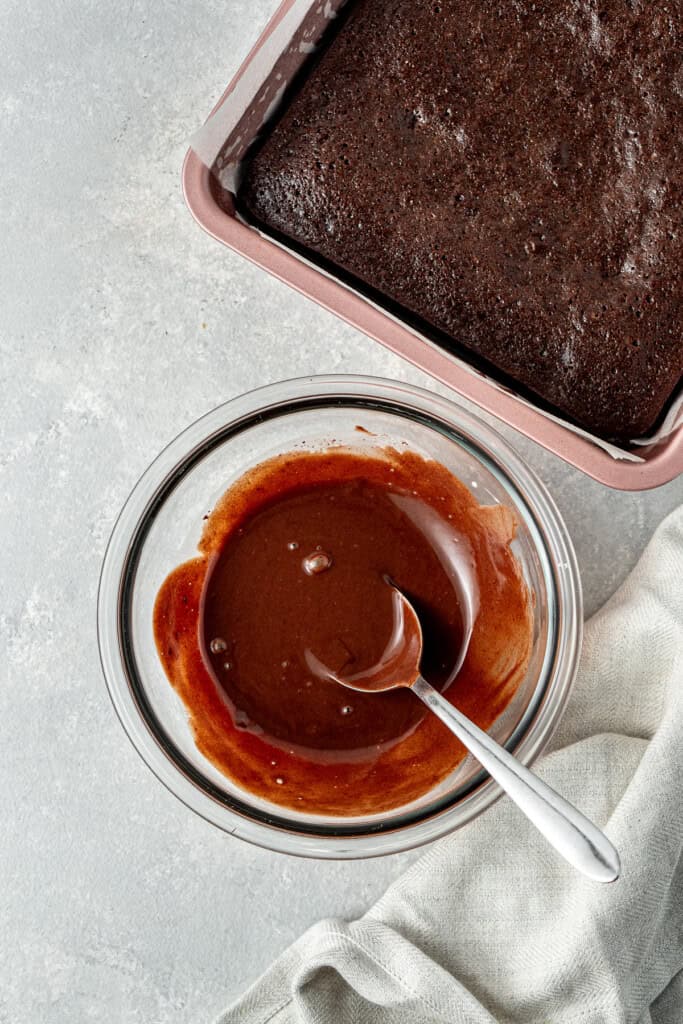 Mixing up the dark chocolate peppermint ganache in a small glass bowl.