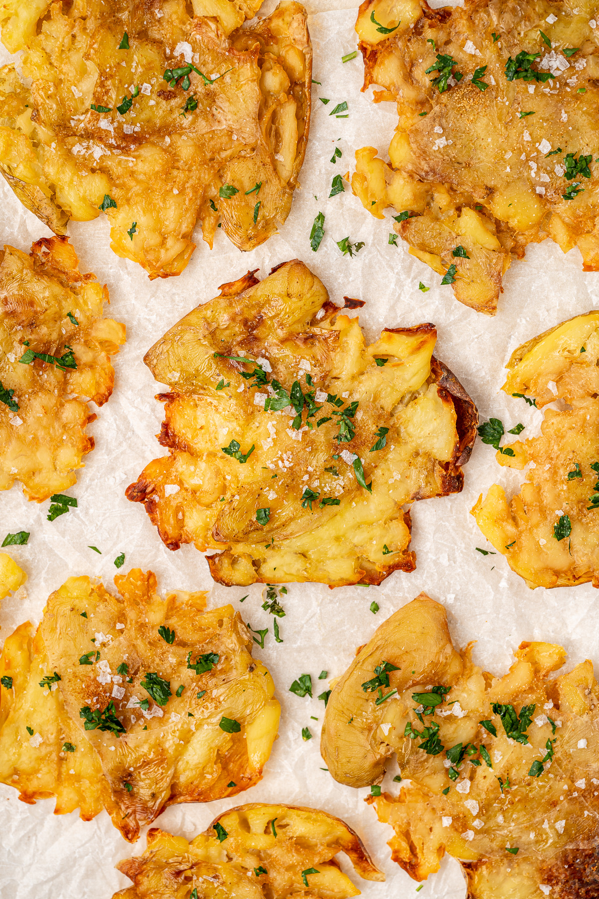 Close up of crispy salt and vinegar smashed potatoes. 