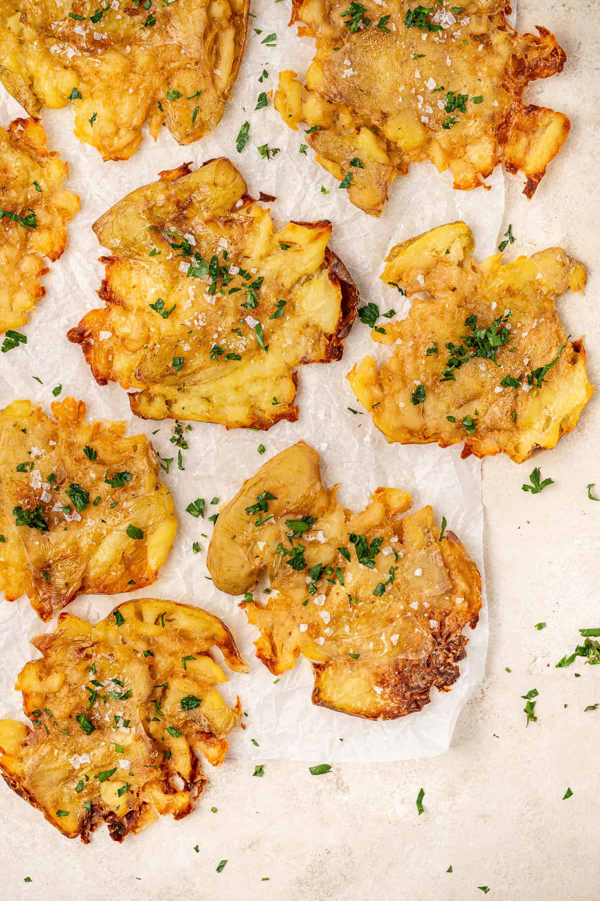 Crispy salt and vinegar smashed potatoes with parsley. 