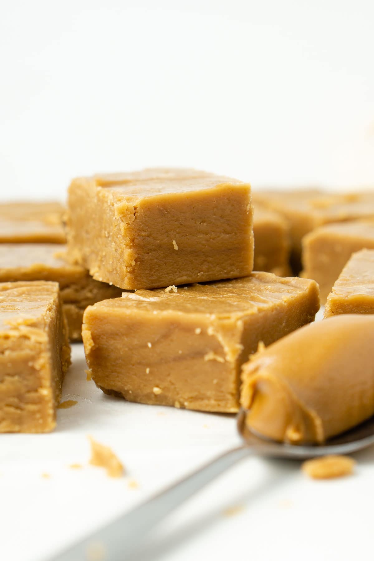Squares of biscoff fudge stacked.