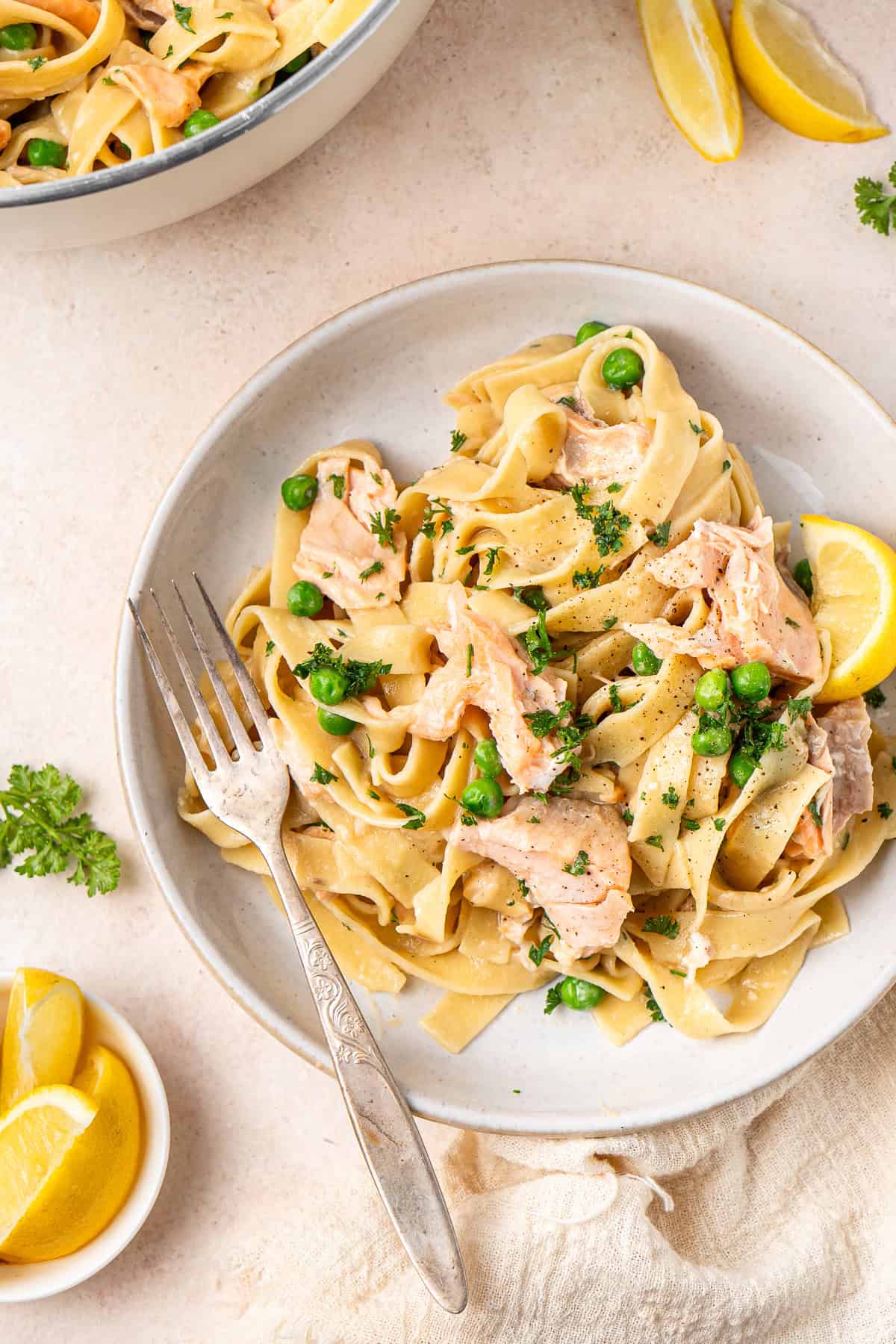 Close up of the creamy salmon pasta with a fork.