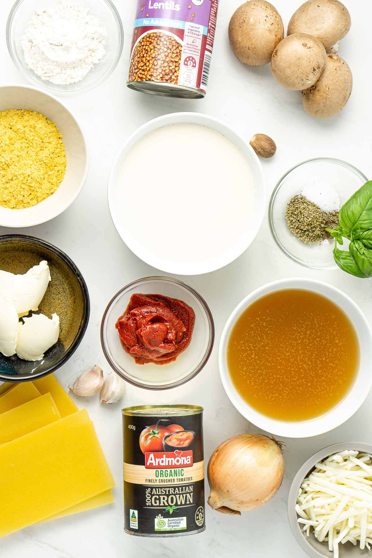 all ingredients for vegan lentil lasagne laid out in little bowls