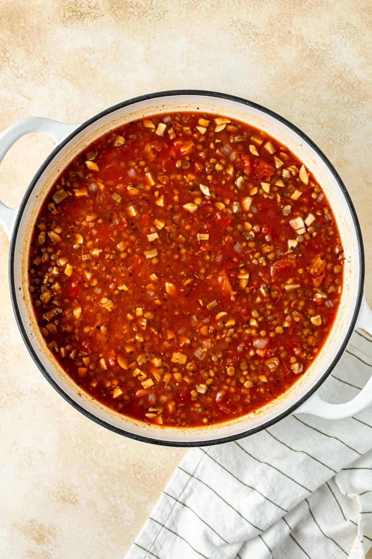 All tomato sauce ingredients in a pan.