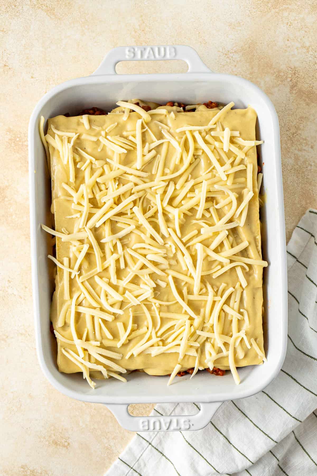 The finished lasagne in a dish ready for the oven.