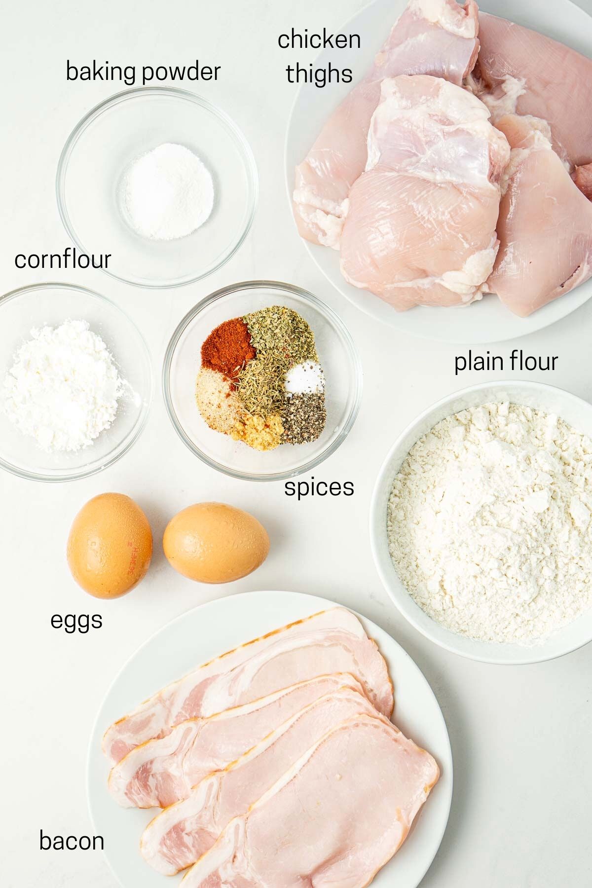 All ingredients laid out needed to make fried chicken burgers.