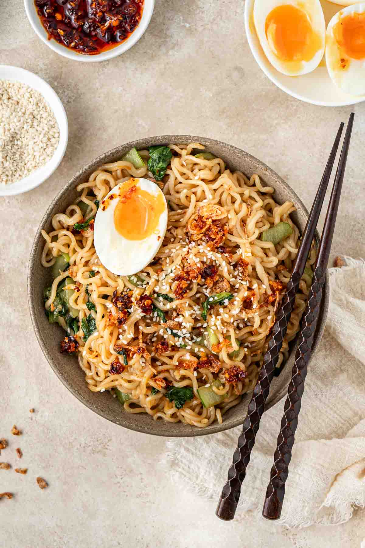 5 minute sweet and spicy noodles with chopsticks and a soft boiled egg.