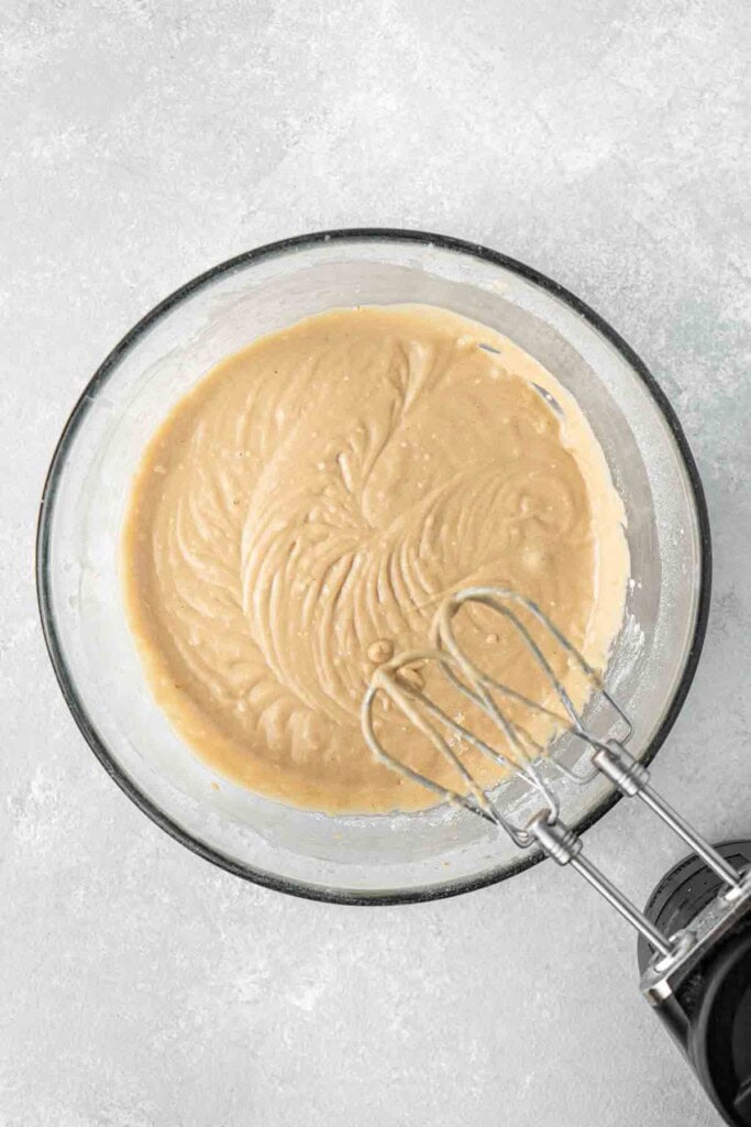 The cupcake batter in a glass bowl.