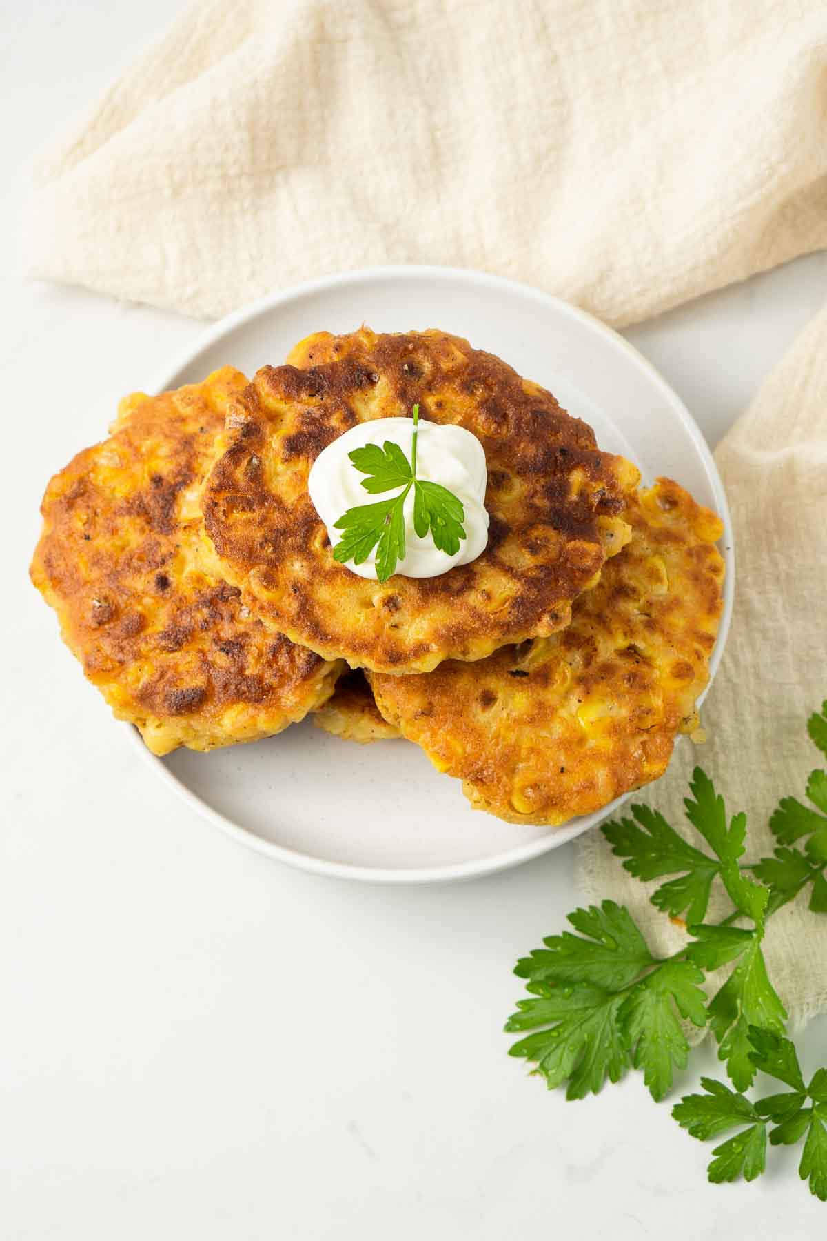 Corn fritters on a plate.