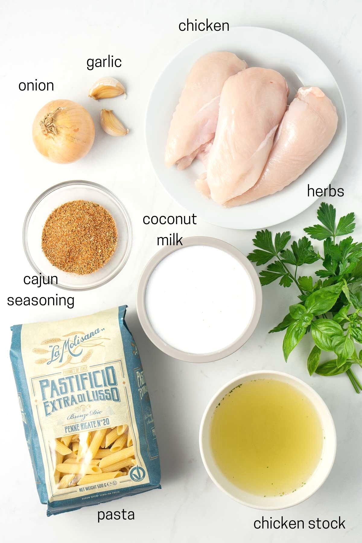 all ingredients needed for creamy cajun chicken pasta laid out.