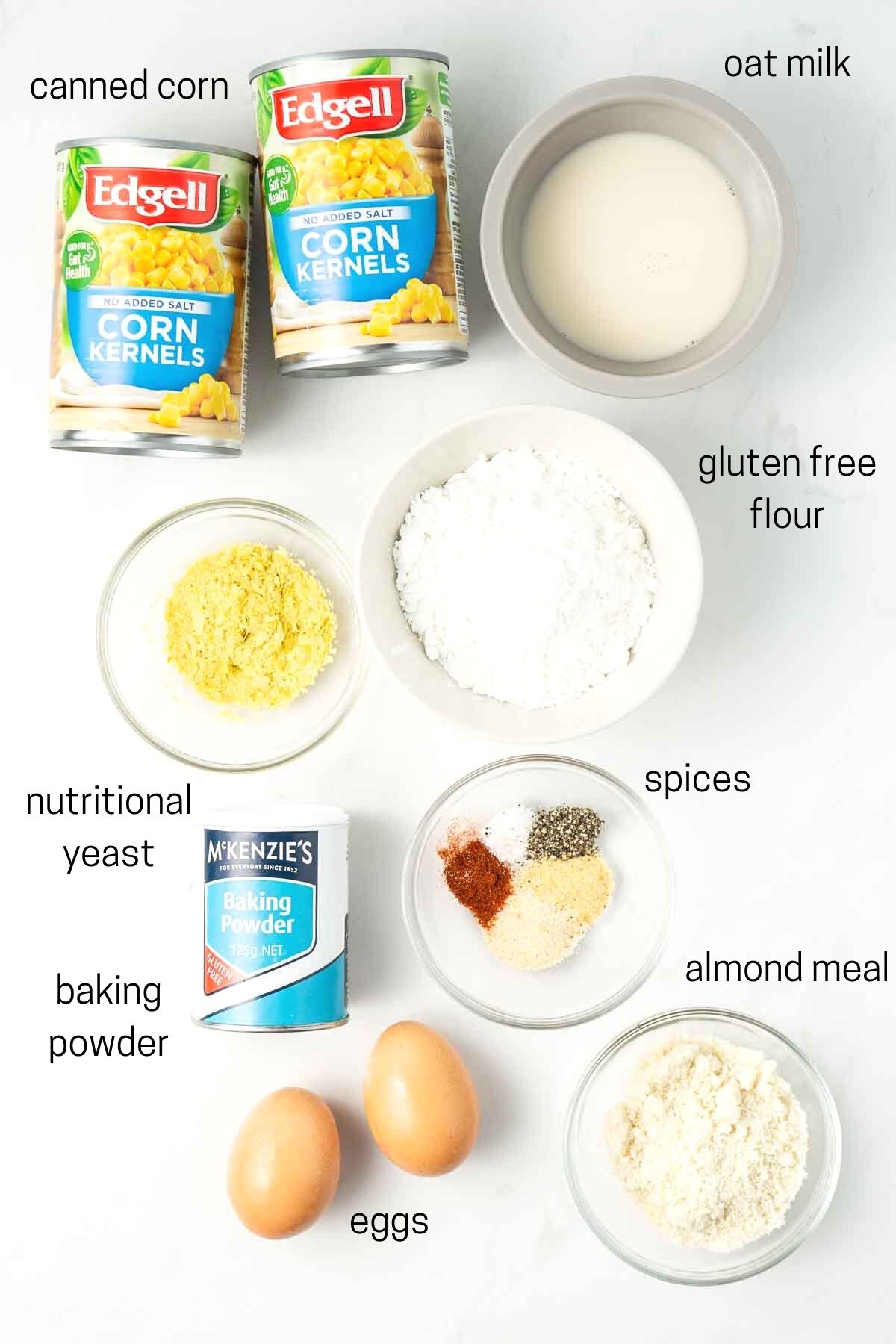 All ingredients needed for fritters laid out in small bowls.