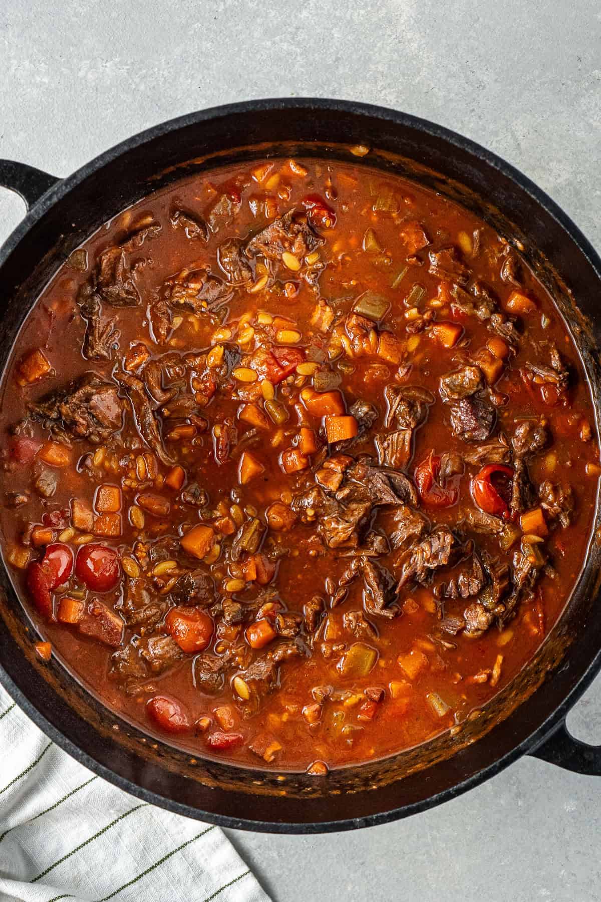 The risoni and beef added to the soup to finish in the pot.