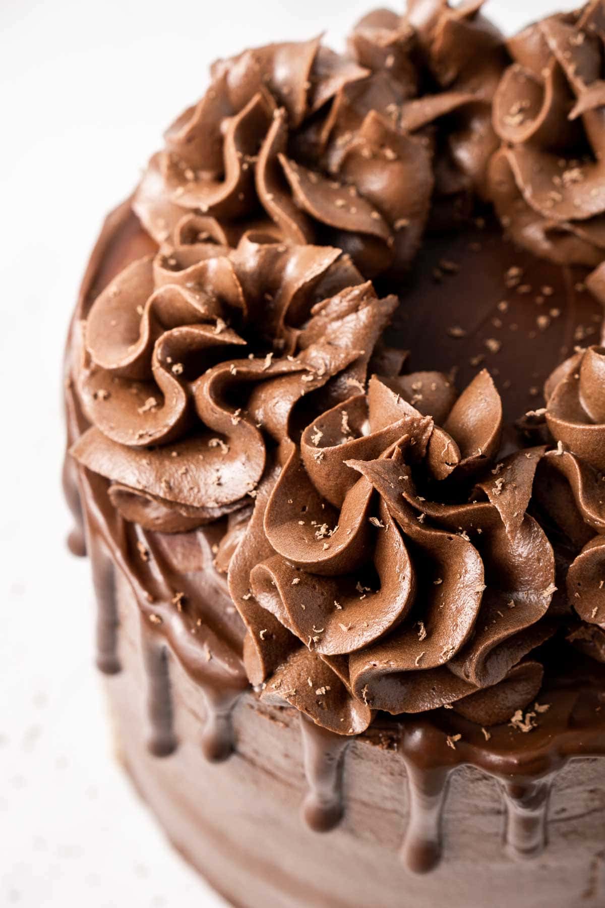 Close up of chocolate buttercream ruffles on top of the cake.