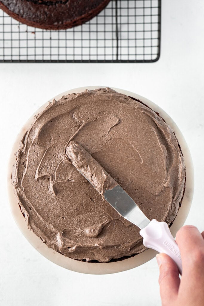 Assembling the cake.