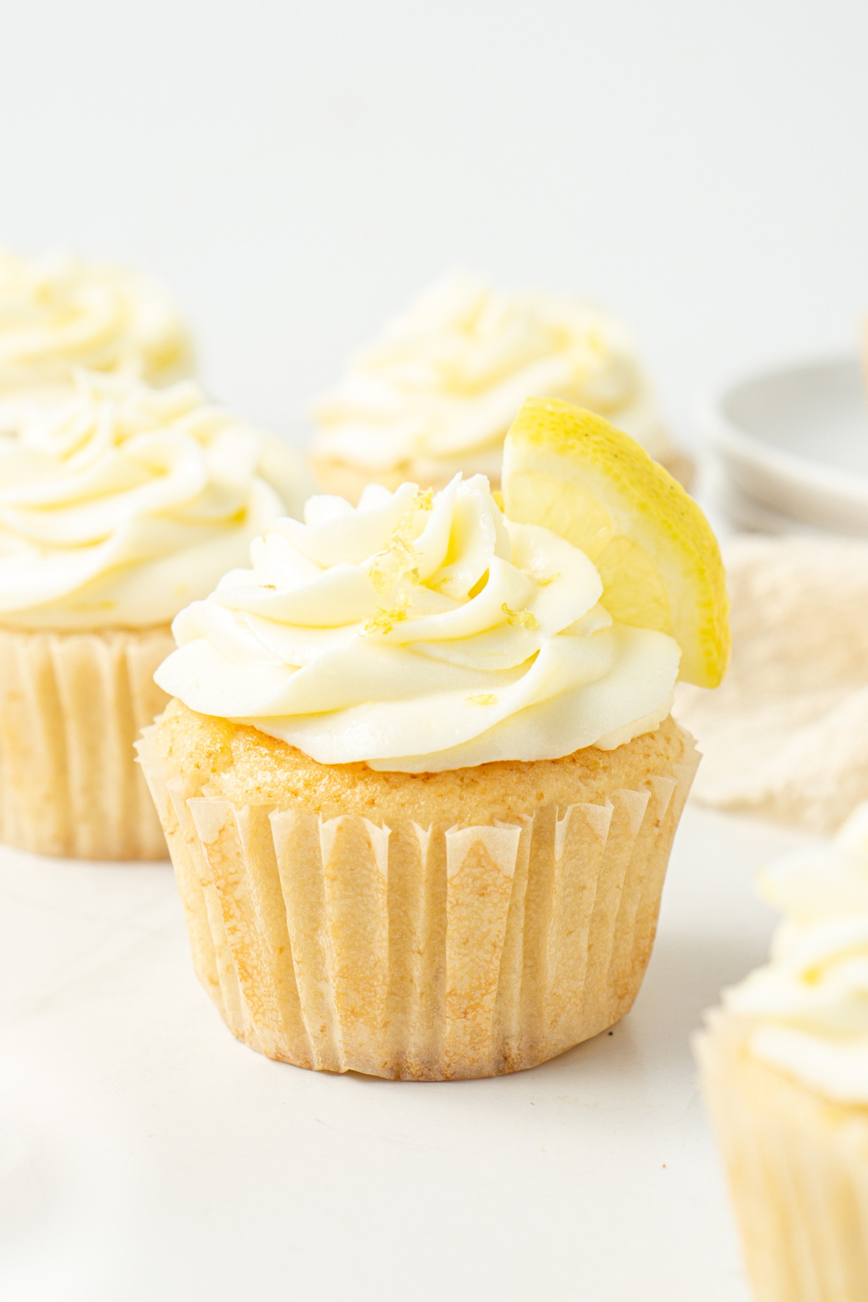 Vegan lemon cupcake with fresh lemon.