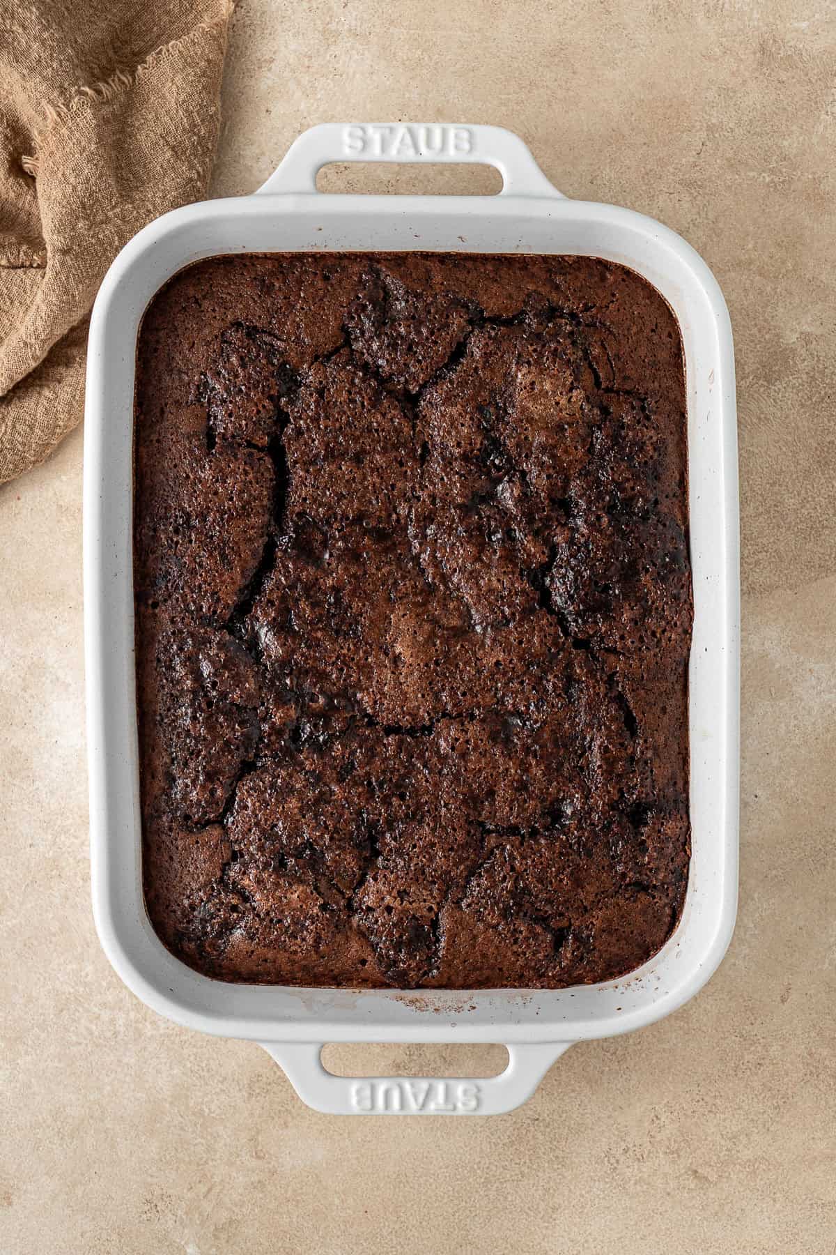 The baked chocolate pudding in a baking dish.
