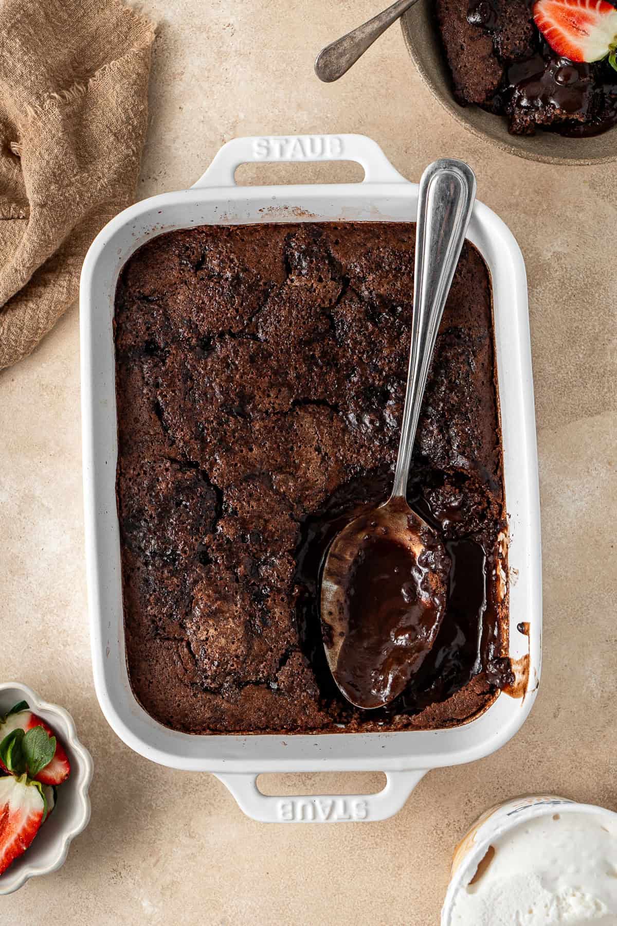 The chocolate self saucing pudding with a slice served.