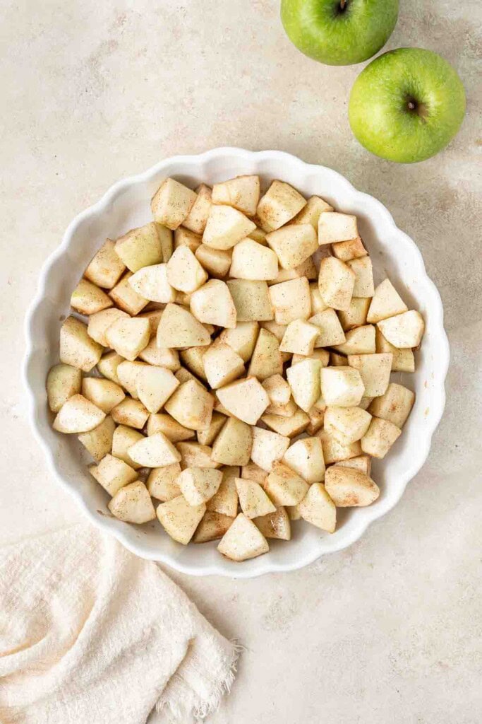 Chopped apples in a baking dish.