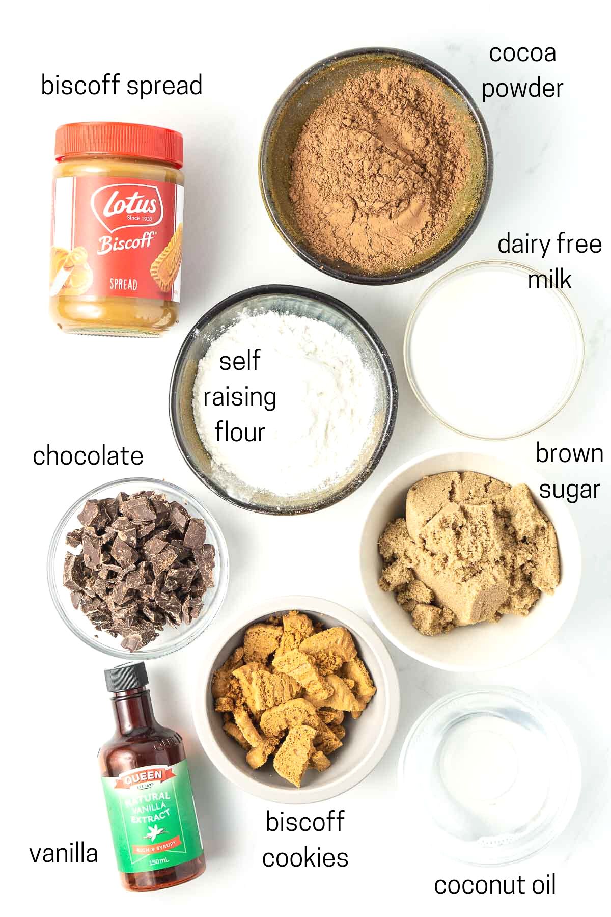All ingredients needed for vegan biscoff brownies laid out in small bowls.