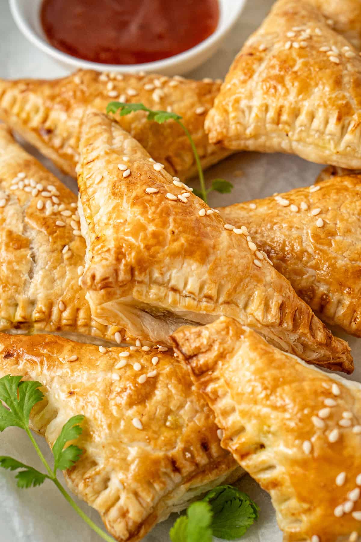 Close up of the golden brown vegetable curry puffs.
